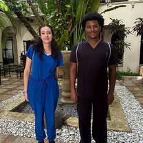 Two participants standing in scrubs