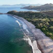 Aerial view of a wild jungle-backed beach on Costa Rica's Pacific coast, home to the sea turtle conservation program