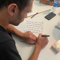Beautiful precision! Our students explore the elegance of the Arabic language through hands-on calligraphy workshops, mastering letter forms and classic strokes step by step.