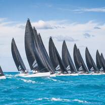 Illustrative image of a sailing fleet racing in Sardinian waters