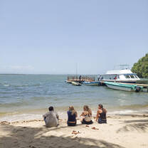 VISIONS Dominican Republic participants sitting at the beach