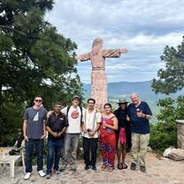 Iguana Abroad students standing near a cross during Semana Santa in Mexico