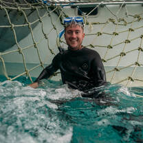 man in snorkeling gear in the water