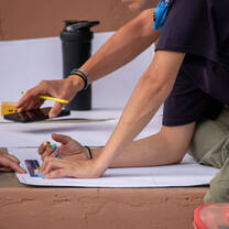 Checking the building plan for a washroom to be constructed 