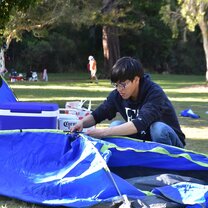 Setting up a tent during the camping trip Preparing to set up a tent during the camping trip