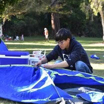 Preparing to set up a tent during the camping trip