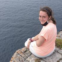Sitting on the edge of a cliff enjoying every moment 
