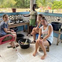 Helping our cook prepare some fufu for dinner