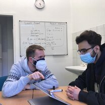 Teaching in the Center (with Corona masks)