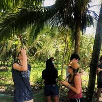 Drinking out of freshly picked coconuts in Parismina