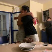 Hugging Débora because she made a "goodbye-cake"