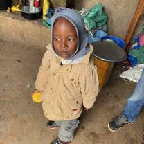 One of the children waiting for lunch