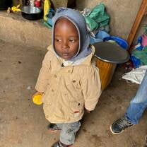 One of the children waiting for lunch