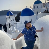 Me with the famed blue domed churches in Oia, Santorini!