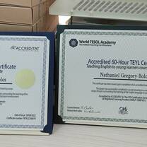 Proudly displaying my certificates on my desk.