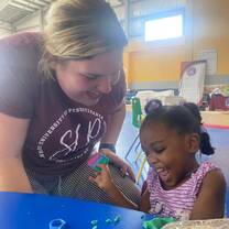 working on fine motor and language through play dough activities 
