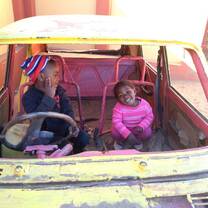 Children in a toy car