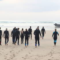 Warriors group walking to the boat at Sodwana bay, on the way to scuba dive. 