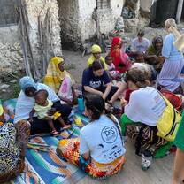 Weaving bracelets with the local women in the village