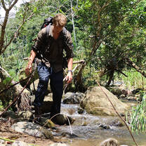 Trekking through a jungle river
