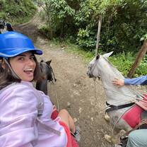 Me riding a horse after hiking through the beautiful waterfalls of Monteverde.