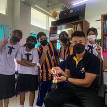 Students giving Phuang Malai (Floral garland) as a sign of respect.