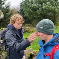 Ben blessing Niall with a magical rock 