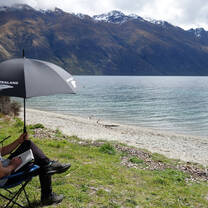 Enjoying a book under the sun.