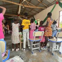 Students worshipping at a local school in Kokrobite 