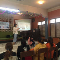 A presentation on the environmental benefits of having a household garden to local women