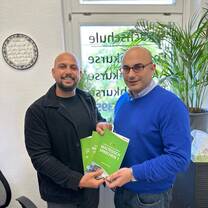 Presenting the Maltesisch für Ausländer series to the Head of the Institute
