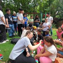 Face painting with kids at Sonido del Yaque