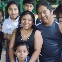 A selfie of me and my host family in the community's playground.