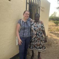 Gertrude the head teacher of Mwenilondo Primary School and me in front of the change room for girls