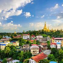 a view of Yangon with the famous Shwedagon pagoda seen in the background