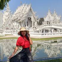 Tia Moua at Wat Rong Khun temple in Chiang Rai, Thailand.