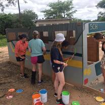 Outreach - painting a playground bus for local crèche.