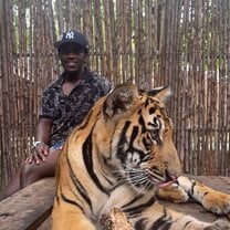 Petting a tiger in Thailand.