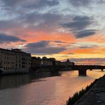 The sunset over the beautiful Arno River. 