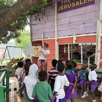Reading a book at the orphanage