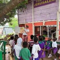 Reading a book at the orphanage
