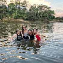 Swimming in a tributary of the Amazon River with some of my now best friends