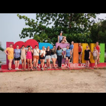 The group in front of the town sign.
