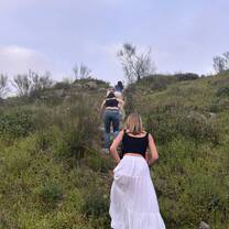 Hiking up a mountain to see the sunset over Toledo