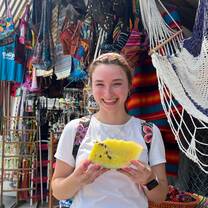 Me in the market trying yellow watermelon for the first time! 