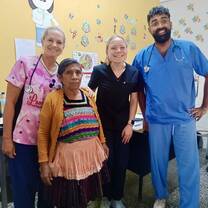 Health clinic with other volunteers and patient 