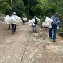 Walking into the jungle mountains to work. 