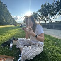 Eating pizza in the park near the Eiffel Tower