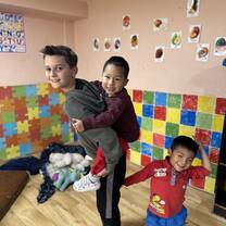 Our son playing with the kids