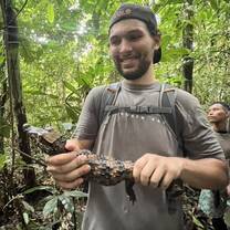This was in the Amazon with a baby caiman. We found this on our hike out to our campsite in the middle of the jungle. This was one of many animals from pink dolphins to one of the largest birds of prey in the world. I spent a whole week there and will never forget this experience. 